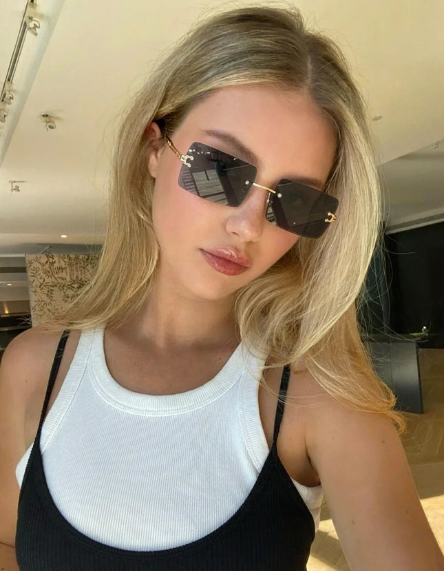 Hot-selling square rimless sunglasses, ultra-light, comfortable, multi-color lenses, stylish and practical.